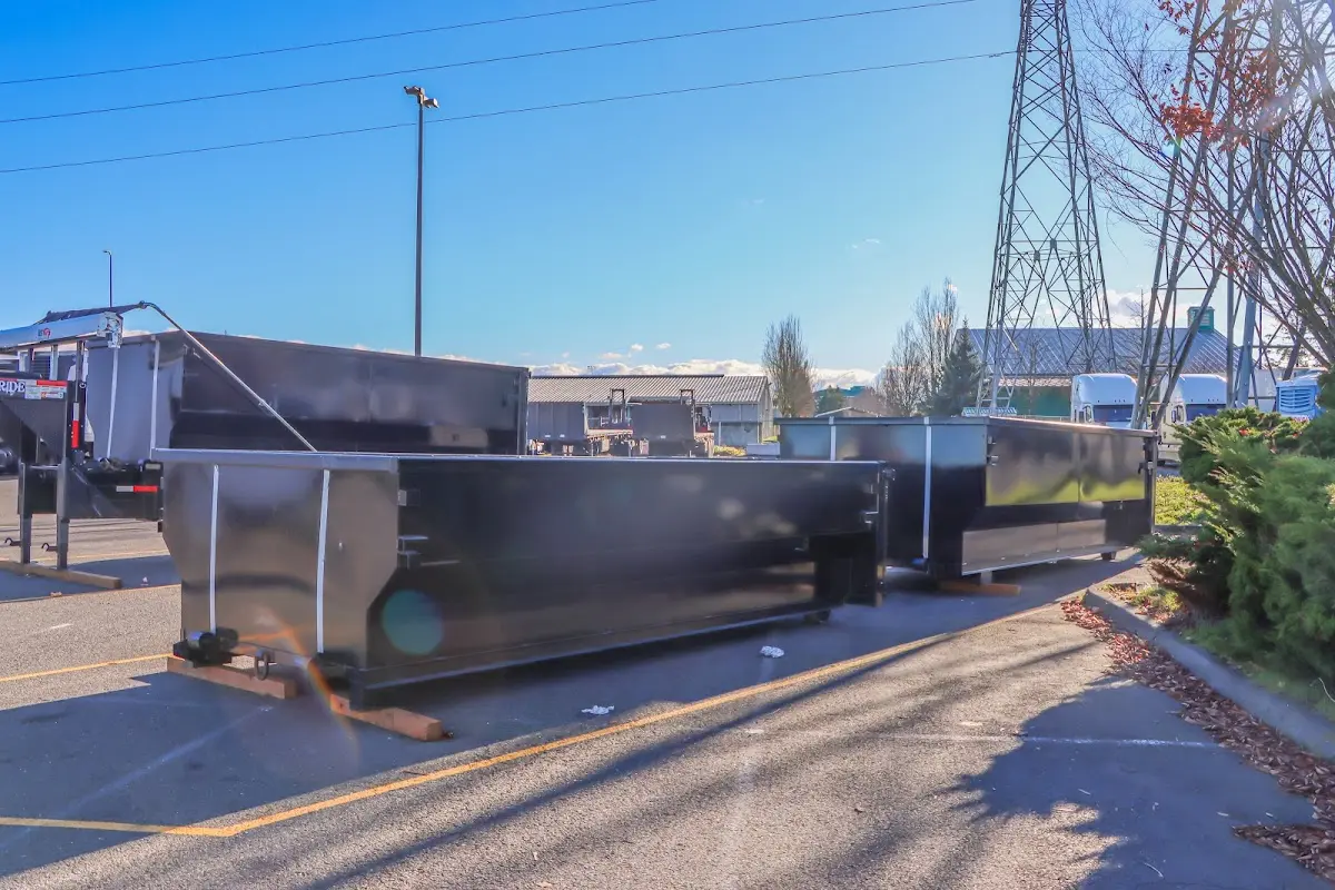 Roll-off dumpster ready for waste disposal at job site for 15 Yard Dumpster Rental in Brookline